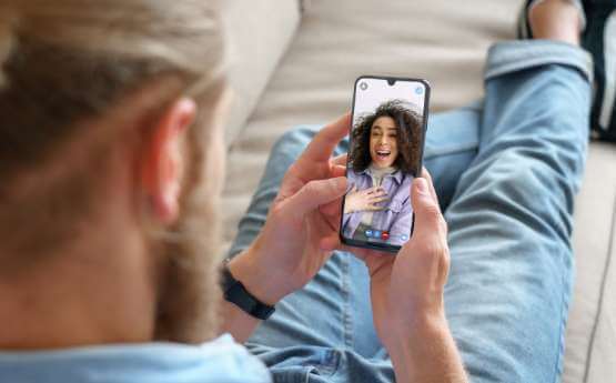 A young man using WiFi calling on a mobile device